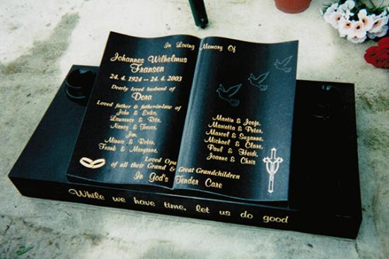 Low rise memorial in a wave shape crafted from granite by Stoneworx - Memorials of Distinction in New Zealand.