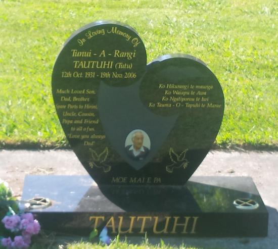 Stylised heart and koru shape custom headstone crafted from granite by Stoneworx - Memorials of Distinction in New Zealand.