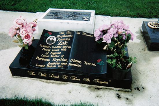 Low rise memorial in a wave shape crafted from granite by Stoneworx - Memorials of Distinction in New Zealand.