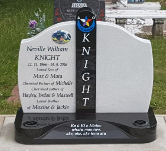 Double headstone with a high saddle design with a column in the middle, in white and black granite crafted by Stoneworx - Memorials of Distinction in New Zealand.