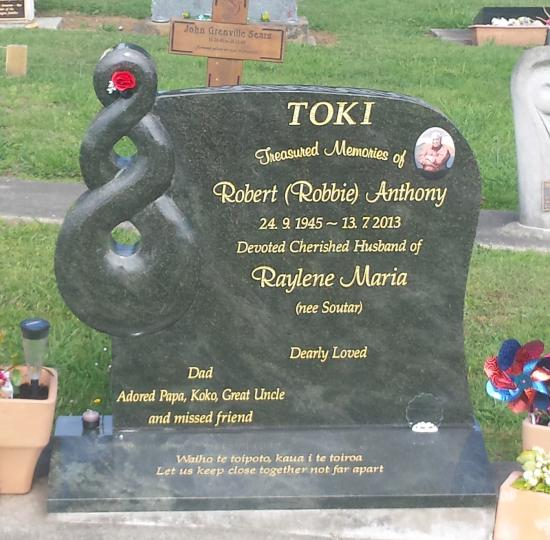 Custom headstone design with a carved koru crafted from granite by Stoneworx - Memorials of Distinction in New Zealand.
