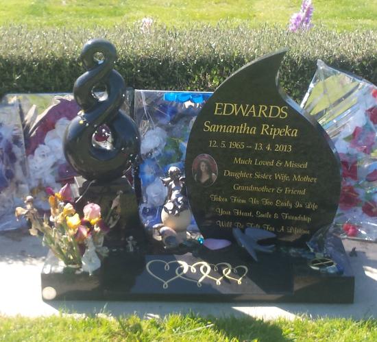 Custom headstone design with a carved koru crafted from granite by Stoneworx - Memorials of Distinction in New Zealand.
