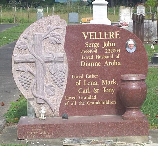 Custom headstone design with a carved cross and grape design crafted from granite by Stoneworx - Memorials of Distinction in New Zealand.