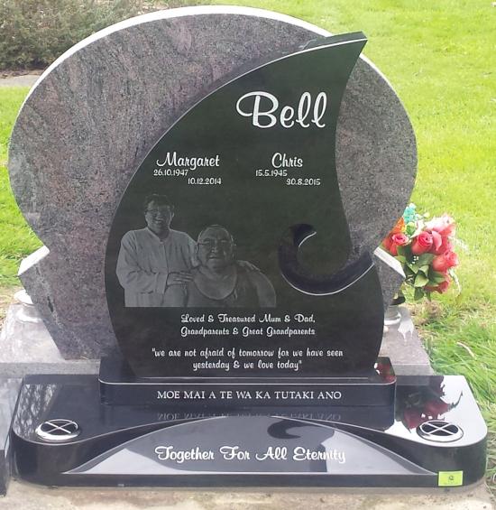 A custom shape headstone with etched image crafted from granite by Stoneworx - Memorials of Distinction in New Zealand.