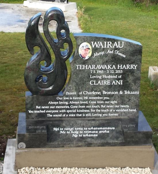 Custom headstone design with a carved koru crafted from granite by Stoneworx - Memorials of Distinction in New Zealand.