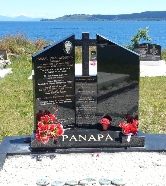 Custom companion headstone with opposing angled tops and centre pillar plus a cross crafted from granite by Stoneworx - Memorials of Distinction in New Zealand.