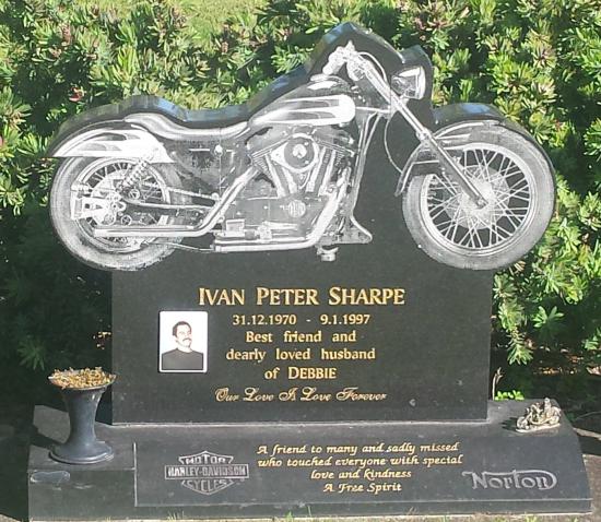 Custom headstone design with a carved motorbike crafted from granite by Stoneworx - Memorials of Distinction in New Zealand.