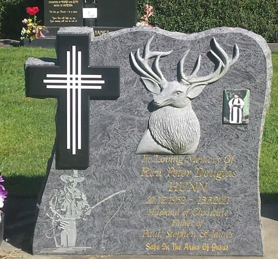 Custom headstone design with a carved deer and cross crafted from granite by Stoneworx - Memorials of Distinction in New Zealand.