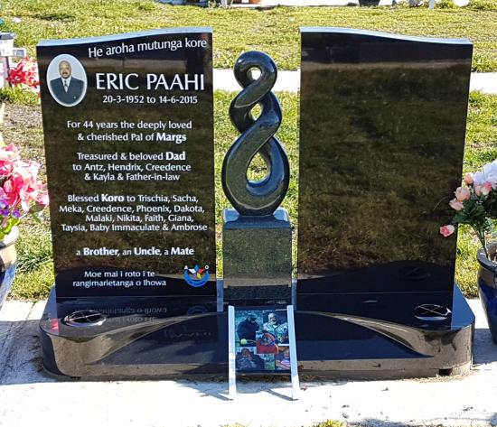 Custom companion headstone design with a carved koru crafted from granite by Stoneworx - Memorials of Distinction in New Zealand.