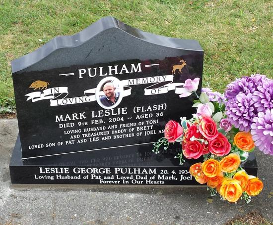 A custom shape headstone with mountain carved top crafted from granite by Stoneworx - Memorials of Distinction in New Zealand.