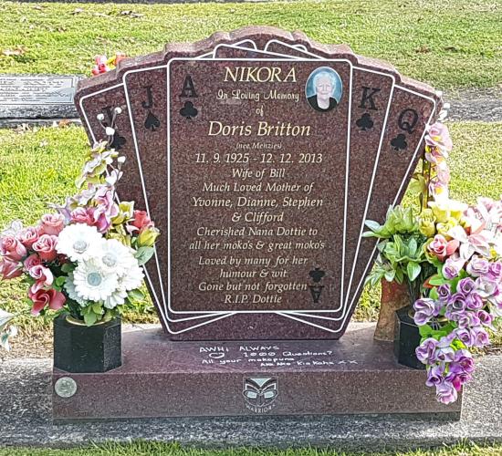Custom headstones in a design showing multiple playing cards crafted from granite by Stoneworx - Memorials of Distinction in New Zealand.