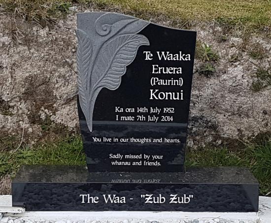 Custom headstone with carved koru and leaves crafted from granite by Stoneworx - Memorials of Distinction in New Zealand.