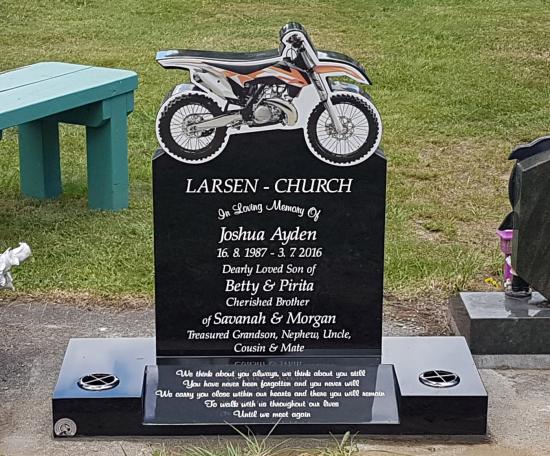 Custom headstone with motorbike design crafted from granite by Stoneworx - Memorials of Distinction in New Zealand.