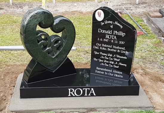 Custom headstone with heart and koru  design crafted from granite by Stoneworx - Memorials of Distinction in New Zealand.