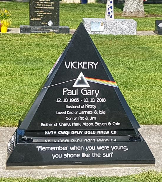 Custom headstone design for a pink floyd fan in the prism shape with a rainbow crafted from granite by Stoneworx - Memorials of Distinction in New Zealand.