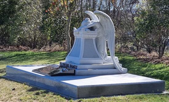 Custom headstone with large kneeling angel crafted from granite by Stoneworx - Memorials of Distinction in New Zealand.