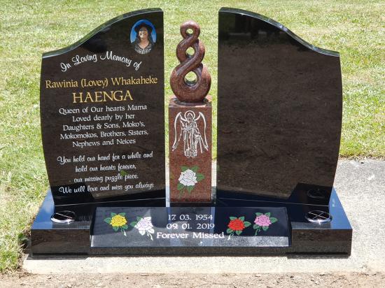 Custom companion headstone with a koru in the centre crafted from granite by Stoneworx - Memorials of Distinction in New Zealand.