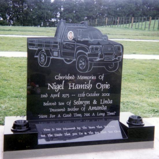 Custom headstone with etching of truck crafted from granite by Stoneworx - Memorials of Distinction in New Zealand.