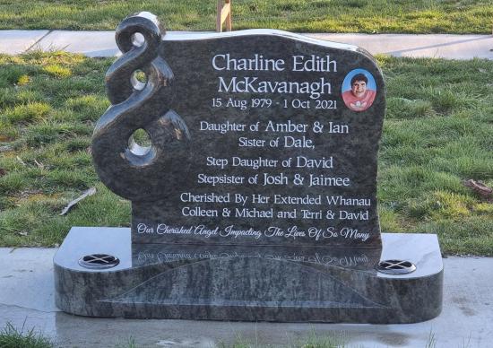 Custom headstone with a koru crafted from granite by Stoneworx - Memorials of Distinction in New Zealand.