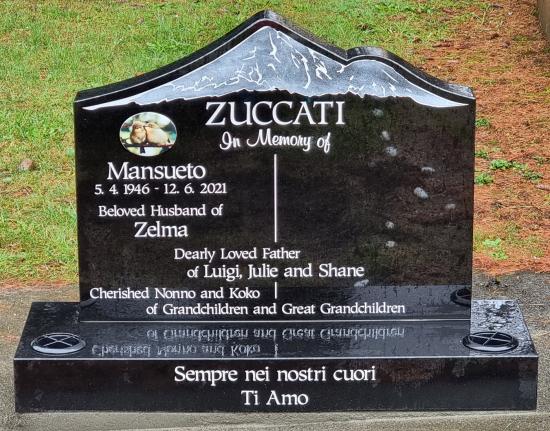 Custom headstone with a mountain design at the top crafted from granite by Stoneworx - Memorials of Distinction in New Zealand.