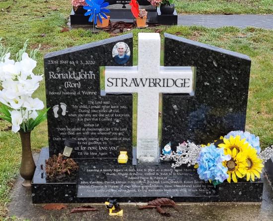 Custom headstone for two people in black with a white cross crafted from granite by Stoneworx - Memorials of Distinction in New Zealand.