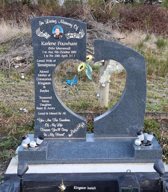 Custom headstone with heart shaped cut out crafted from granite by Stoneworx - Memorials of Distinction in New Zealand.