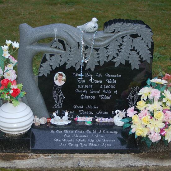 Custom headstone with carved tree crafted from granite by Stoneworx - Memorials of Distinction in New Zealand.