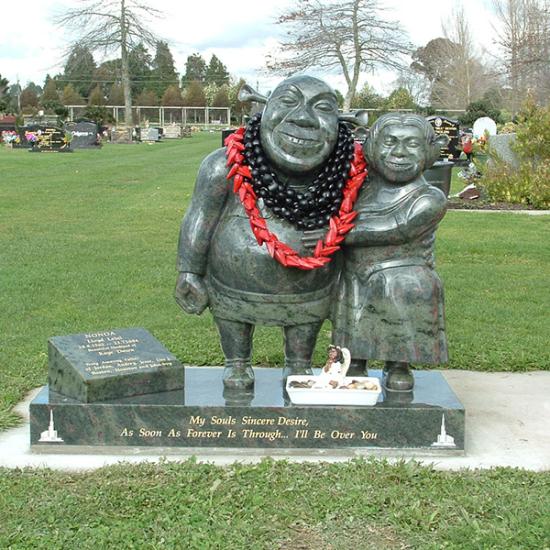 Custom headstone design with a carved shrek and fiona design crafted from granite by Stoneworx - Memorials of Distinction in New Zealand.