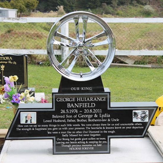 Custom headstone with a wheel crafted from granite and metalby Stoneworx - Memorials of Distinction in New Zealand.