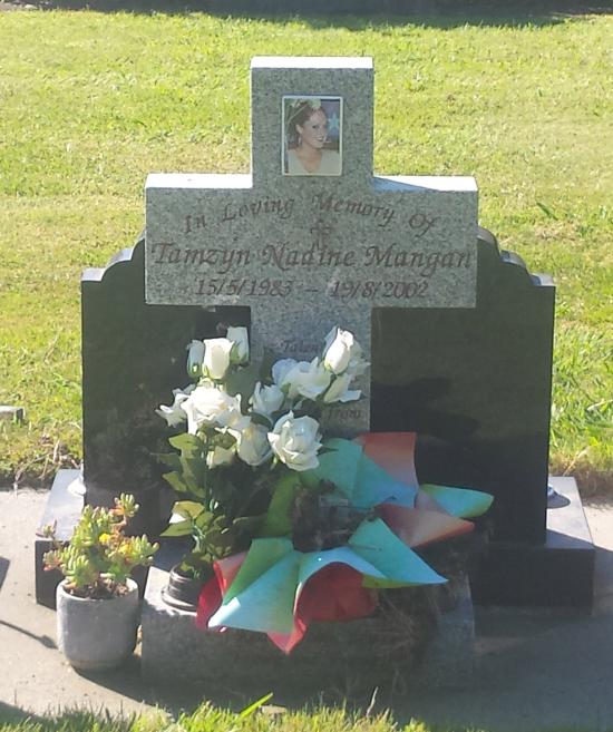 Custom headstone design with a central cross crafted from granite by Stoneworx - Memorials of Distinction in New Zealand.
