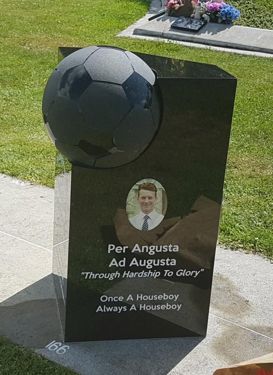 Custom headstone with football crafted from granite by Stoneworx - Memorials of Distinction in New Zealand.