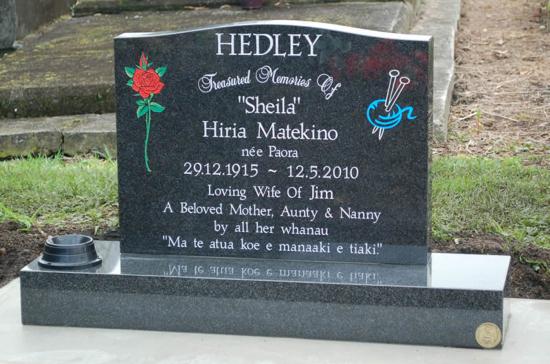 Classic upright headstone with low saddle top crafted from granite by Stoneworx - Memorials of Distinction in New Zealand.