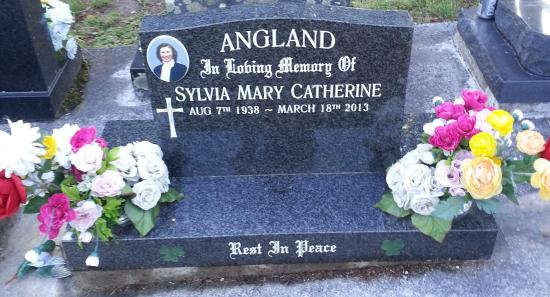 Classic upright headstone with low saddle top crafted from granite by Stoneworx - Memorials of Distinction in New Zealand.