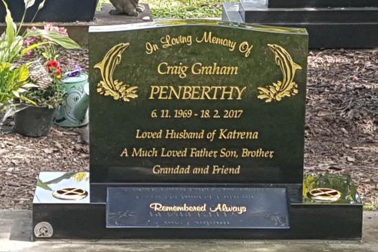 Classic upright headstone with low saddle top crafted from granite by Stoneworx - Memorials of Distinction in New Zealand.