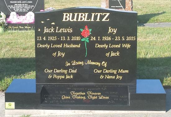 Classic upright headstone with low saddle top crafted from granite by Stoneworx - Memorials of Distinction in New Zealand.