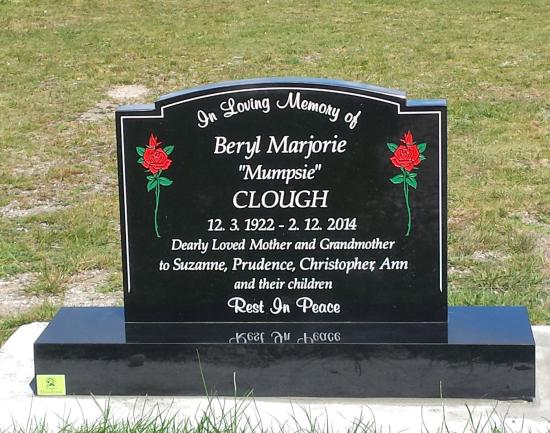 Classic upright headstone in the ‘camber with checks’ shape crafted from granite by Stoneworx - Memorials of Distinction in New Zealand.