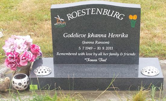 Classic upright headstone with low saddle top crafted from granite by Stoneworx - Memorials of Distinction in New Zealand.