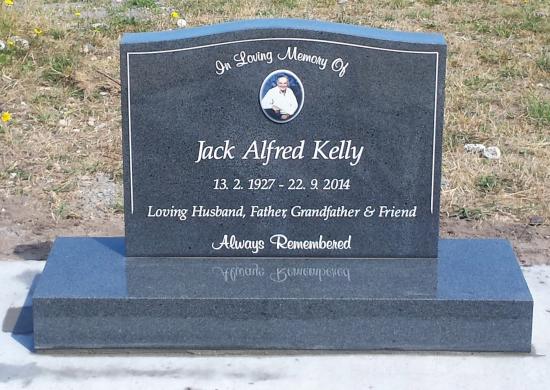 Classic upright headstone with low saddle top crafted from granite by Stoneworx - Memorials of Distinction in New Zealand.