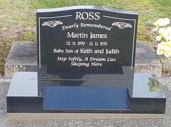 Classic upright headstone with low saddle top crafted from granite by Stoneworx - Memorials of Distinction in New Zealand.