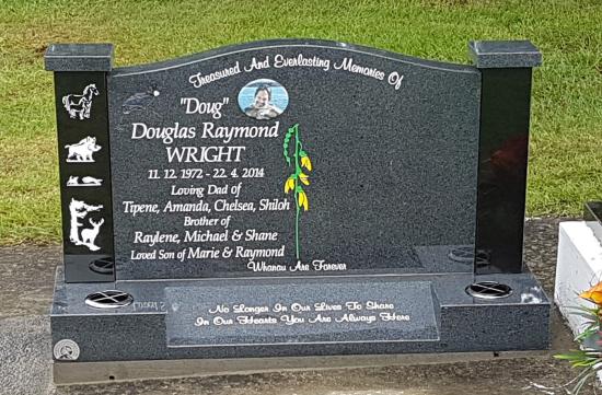 Classic upright headstone with low saddle top and side pillars crafted from granite by Stoneworx - Memorials of Distinction in New Zealand.