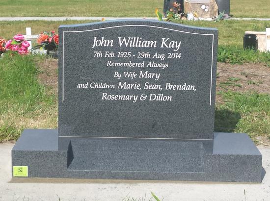 Classic upright headstone with low saddle top crafted from granite by Stoneworx - Memorials of Distinction in New Zealand.