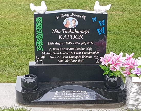 Classic upright headstone with low saddle top crafted from granite by Stoneworx - Memorials of Distinction in New Zealand.