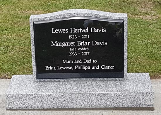 Classic upright headstone with low saddle top crafted from light grey granite by Stoneworx - Memorials of Distinction in New Zealand.