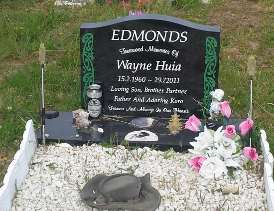 Classic upright headstone with high saddle top crafted from granite by Stoneworx - Memorials of Distinction in New Zealand.