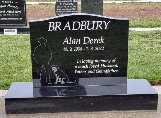 Classic upright headstone with low saddle top crafted from granite by Stoneworx - Memorials of Distinction in New Zealand.