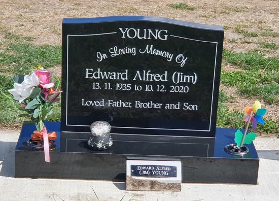 Classic upright headstone with low saddle top crafted from granite by Stoneworx - Memorials of Distinction in New Zealand.