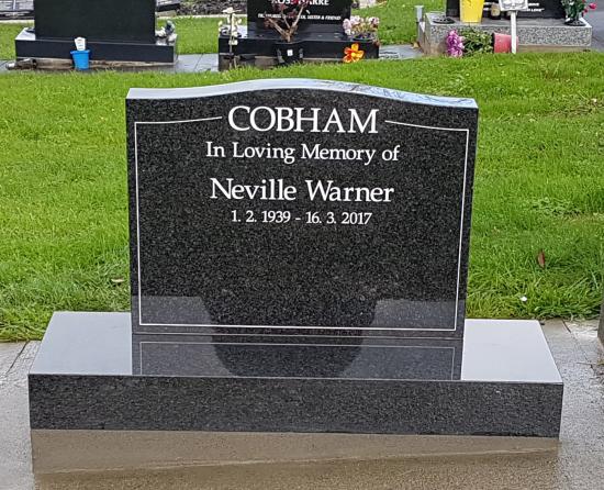 Classic upright headstone with low saddle top crafted from granite by Stoneworx - Memorials of Distinction in New Zealand.