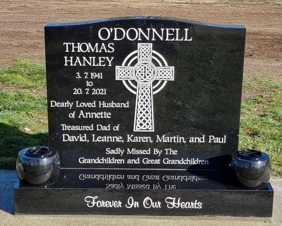 Classic upright headstone with low saddle top crafted from granite by Stoneworx - Memorials of Distinction in New Zealand.