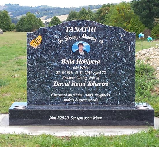 Classic upright headstone with a variant on a high saddle top crafted from granite by Stoneworx - Memorials of Distinction in New Zealand.