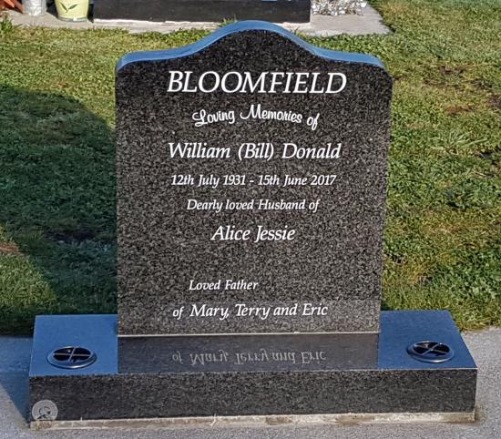 Upright headstone with extra high saddle top crafted from granite by Stoneworx - Memorials of Distinction in New Zealand.